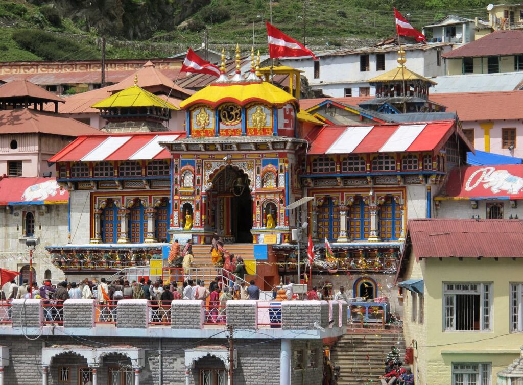 Badrinath Temple with snow-covered Himalayan peaks and Alaknanda River