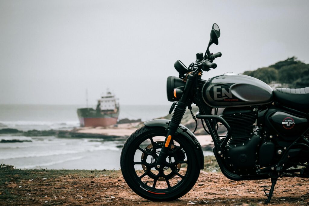 Royal Enfield Hunter 350 side view in an artistic, high-contrast background for studio look.